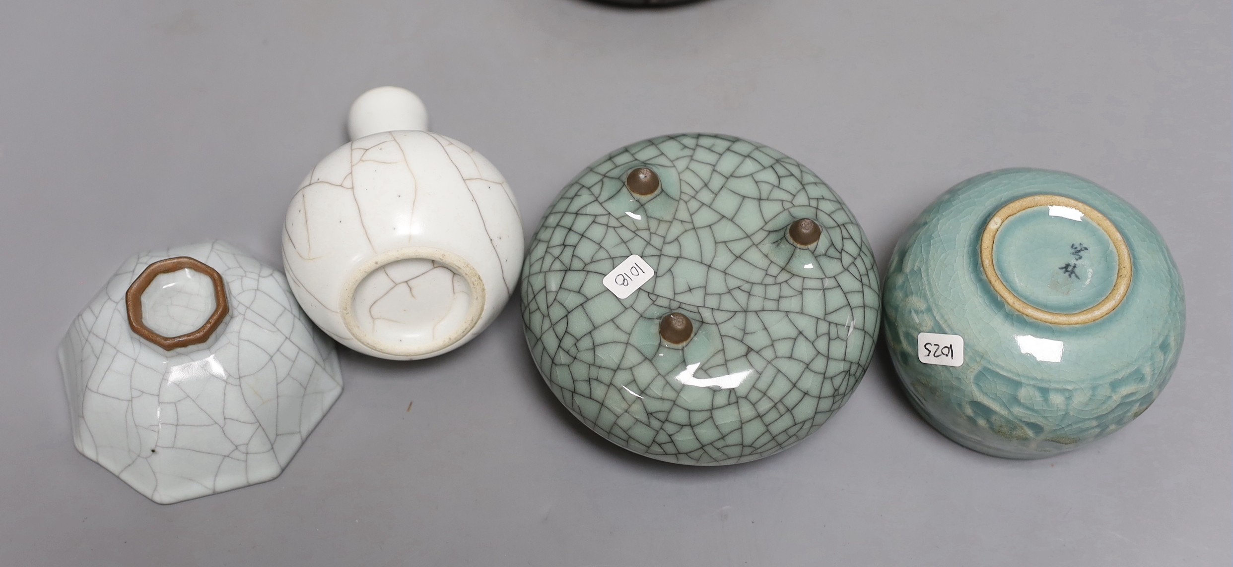 Three Chinese crackle glaze vessels, a Korean celadon pot and a hardwood stand